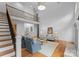 Inviting living room with high ceilings and staircase, offering open space and modern comfort at 440 S Sharon Amity Rd, Charlotte, NC 28211