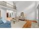 Bright living room showcasing hardwood floors, high ceilings, open floorplan, and comfortable seating at 440 S Sharon Amity Rd, Charlotte, NC 28211