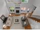 Bright living room with fireplace, large windows, and hardwood floors at 440 S Sharon Amity Rd, Charlotte, NC 28211