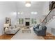 Spacious living room with high ceilings, fireplace, and large windows, creating a welcoming atmosphere at 440 S Sharon Amity Rd, Charlotte, NC 28211