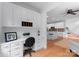 Well-lit home office with built-in cabinetry, desk space, and views into the main living area at 440 S Sharon Amity Rd, Charlotte, NC 28211