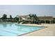 Community pool featuring a slide and ample seating at 5076 Timber Falls Dr, Indian Land, SC 29707
