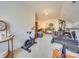 Bright workout room featuring an exercise bike, treadmill, and free weights at 5076 Timber Falls Dr, Indian Land, SC 29707