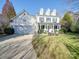 Charming two-story home with a well-manicured lawn, and a welcoming front porch at 5076 Timber Falls Dr, Indian Land, SC 29707