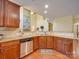 Spacious kitchen features stainless steel appliances, wood cabinets, and granite countertops for cooking at 5076 Timber Falls Dr, Indian Land, SC 29707