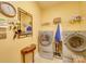 Convenient laundry room with washer, dryer, and storage shelves at 5076 Timber Falls Dr, Indian Land, SC 29707
