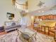 Elegant living room with hardwood floors, decorative rug, and high ceilings provides a luxurious feel at 5076 Timber Falls Dr, Indian Land, SC 29707