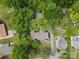 Aerial view of home with driveway and lush green trees surrounding the property at 528 W Park Dr, Monroe, NC 28112