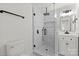 Modern bathroom featuring a glass-enclosed shower, white vanity, and black hardware at 528 W Park Dr, Monroe, NC 28112