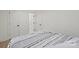 Bright bedroom featuring neutral walls, wooden floors, and stylish black hardware at 528 W Park Dr, Monroe, NC 28112