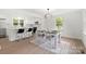 Bright dining room with modern decor, seamlessly connected to a stylish kitchen and open-concept layout at 528 W Park Dr, Monroe, NC 28112