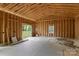 Interior view of new construction garage with unfinished drywall and wooden frame visible at 528 W Park Dr, Monroe, NC 28112