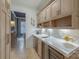 Elegant bar area features custom cabinets, designer backsplash, and modern beverage center at 611 Wisteria Vines Trl, Fort Mill, SC 29708