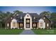 Striking two-story home featuring a gray roof, white brick, dark accents, and a manicured lawn at 611 Wisteria Vines Trl, Fort Mill, SC 29708