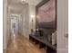 Elegant hallway with hardwood floors, wall paneling, built-in seating, and recessed lighting at 611 Wisteria Vines Trl, Fort Mill, SC 29708