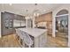 Kitchen island with bar seating, stainless steel appliances, custom cabinetry and a modern design at 611 Wisteria Vines Trl, Fort Mill, SC 29708