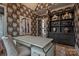 Chic office featuring floral wallpaper, built-in shelving, modern desk, and decor at 611 Wisteria Vines Trl, Fort Mill, SC 29708