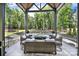 Inviting outdoor space with lounge seating, a fire table, and a swimming pool view at 611 Wisteria Vines Trl, Fort Mill, SC 29708