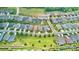 Aerial view of a residential home with manicured lawns in a suburban neighborhood at 6220 Raven Rock Dr, Denver, NC 28037