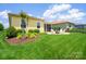 Landscaped backyard with patio, screen porch and outdoor furniture at 6220 Raven Rock Dr, Denver, NC 28037