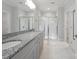Elegant bathroom with a double sink vanity, granite countertops, and frameless glass shower doors at 6220 Raven Rock Dr, Denver, NC 28037