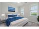 Cozy bedroom featuring a plush bed, soft carpet, and bright natural light from two windows at 6220 Raven Rock Dr, Denver, NC 28037