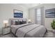 Bedroom featuring a well-lit room with a plush bed, soft carpet, and stylish decor at 6220 Raven Rock Dr, Denver, NC 28037