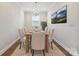 Dining room featuring a classic chandelier and neutral decor, creating an elegant atmosphere at 6220 Raven Rock Dr, Denver, NC 28037