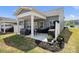 Cozy back patio with an outdoor dining table, grilling station, and comfy lounge seating at 6242 Ashton Park Dr, Denver, NC 28037