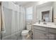 Bathroom featuring a toilet, a sink, and a shower with a shower curtain at 6242 Ashton Park Dr, Denver, NC 28037