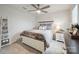 Bedroom with neutral color palette, ceiling fan, and carpeted floors at 6242 Ashton Park Dr, Denver, NC 28037