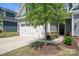 Well maintained home featuring a two-car garage, lovely landscaping, and a welcoming entrance at 6242 Ashton Park Dr, Denver, NC 28037