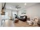 Bright living room with wood floors, ceiling fan, and lots of furniture at 6242 Ashton Park Dr, Denver, NC 28037
