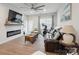 Spacious living room features a fireplace, a fan, and a comfy sofa at 6242 Ashton Park Dr, Denver, NC 28037