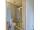 Bathroom showcases a glass-enclosed shower and neutral-toned tile at 6808 Squirrels Foot Ct, Charlotte, NC 28217