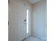 An entryway with a white front door and tiled floor at 6808 Squirrels Foot Ct, Charlotte, NC 28217