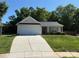 A well-maintained single-story home with an attached garage and landscaped yard at 6808 Squirrels Foot Ct, Charlotte, NC 28217