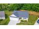 Aerial view of a charming home with a well-maintained lawn and a fenced backyard at 6808 Squirrels Foot Ct, Charlotte, NC 28217