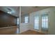 Living area featuring an open layout, laminate flooring, and a door leading to the outside at 6808 Squirrels Foot Ct, Charlotte, NC 28217