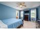 A blue bedroom featuring a bed, windows and a closet at 727 Skinner Rd, Shelby, NC 28152