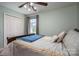 This bedroom features a comfortable bed, neutral walls, a ceiling fan, and a window at 727 Skinner Rd, Shelby, NC 28152
