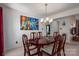 The dining area features views of an art piece and a decorative chandelier at 727 Skinner Rd, Shelby, NC 28152