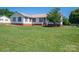 Inviting single-story home with manicured lawn and lush landscaping at 727 Skinner Rd, Shelby, NC 28152