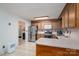 This well-lit kitchen features wooden cabinets and stainless steel appliances at 727 Skinner Rd, Shelby, NC 28152