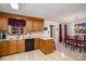 This eat-in kitchen features wood cabinets and flows into a dining area at 727 Skinner Rd, Shelby, NC 28152