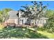 Spacious backyard featuring a wooden deck and lush greenery, perfect for outdoor living at 944 Evian Ln, Matthews, NC 28015