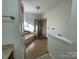 Bathroom featuring a combination tub and shower with tiled surround and a glass door at 944 Evian Ln, Matthews, NC 28015