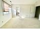 Bedroom featuring carpet flooring, neutral walls, and natural light from the windows with shades at 944 Evian Ln, Matthews, NC 28015