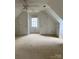 Upstairs bedroom featuring vaulted ceilings, two closets, and natural light at 944 Evian Ln, Matthews, NC 28015