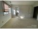 Bright and airy bedroom featuring neutral walls, plush carpeting, and natural light from the windows at 944 Evian Ln, Matthews, NC 28015